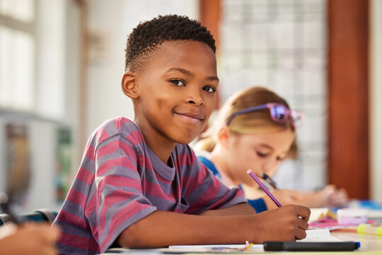 Portrait of happy african american schoolboy in primary school