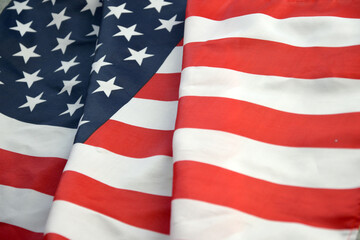 Obraz premium United States of America flag with stars and stripes close up. Official US Banner waving with folds