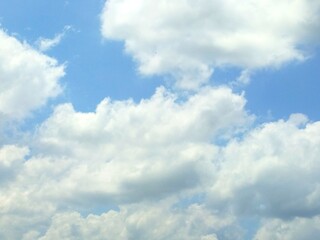 background photo of bright blue sky and white clouds