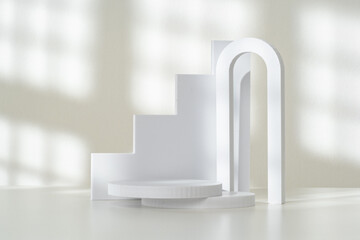 Modern Minimalist White Sculpture Displayed on Soft Draped Fabric in Natural Light