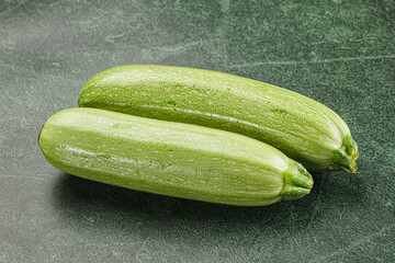 Raw green ripe zucchini vegetable