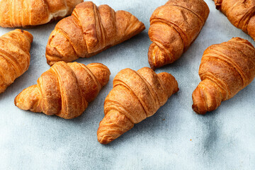 Group of sweet croissant . French morning breakfast . Top view