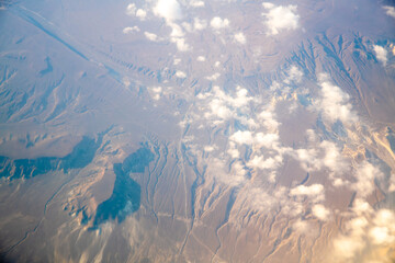 A view of the planet Earth, a view from an airplane, mountains and clouds
