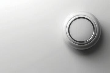 Obraz premium A contemporary smart thermostat is mounted against a clean, solid background, showcasing its elegant design. This device highlights a blend of technology and simplicity, perfect for any modern home.