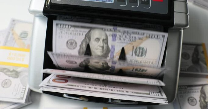 Banknote counter accurately processes dollar bills. Machine precise handling essential for ensuring accurate financial management and transaction record