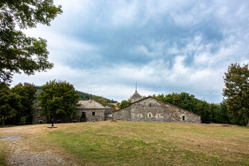 Fototapeta premium View of the pre-Romanesque church of Santa Maria la Real in O Cebreiro from the 9th century. Camino de Santiago, Galicia, Spain.