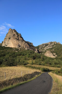 Winding country road near Pic de Bugarach, the highest peak in the Corbieres mountain range located in Aude department, southern France