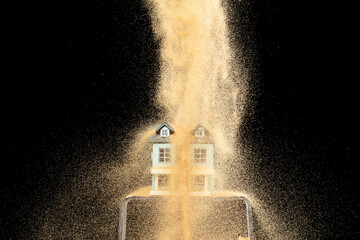 Sand storm hit House as natural disaster from climate change global warming. Strong wind of sand attack house with insurance create loss damage environment. Black background isolated © Jade