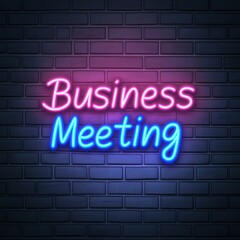 Obraz premium A vibrant neon sign displaying 'Business Meeting' against a dark brick wall, perfect for office decor or corporate presentations.