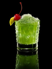 Midori sour cocktail garnished with lemon and a cherry isolated on black