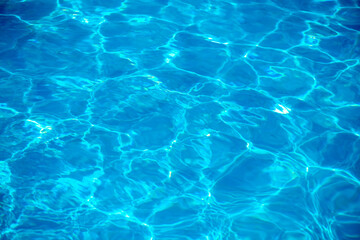 sun glare in the water, water abstract background, clear blue water