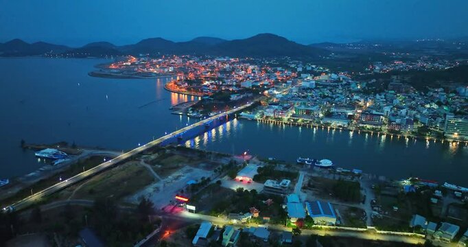 Top view aerial of Ha Tien City with development buildings, transportation, energy power infrastructure. Famous tourist city of Vietnam, sharing the border with Cambodia