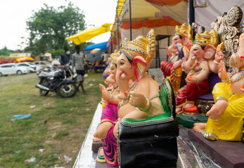 Indian Hindu God Lord Ganesha Statues made of clay and soil, Coated with color sold for Ganesh Chathurthi