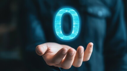 A close-up of a hand holding a zero icon, symbolizing zero tolerance or zero balance.
