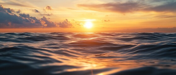 Fototapeta premium Sunset Reflected in the Rippling Ocean Waves