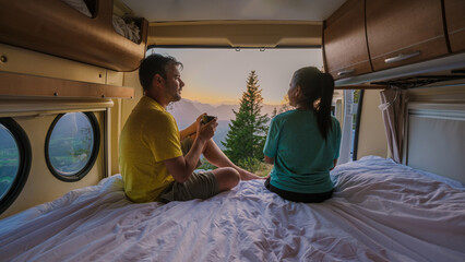 Enjoying a serene sunrise view from a camper van in Hallstatt, Austria with loved ones