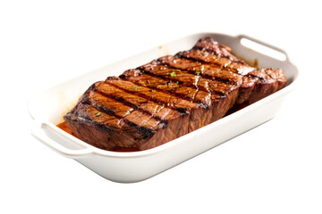 grilled steak in dish isolated on white