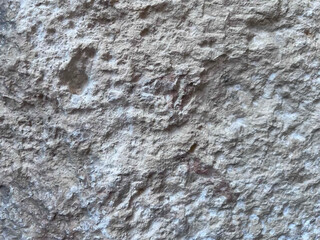 Realistic stone wall texture. Gray background for cover design, postcards, flyers, posters, banners. Empty form for text. Vintage aged shabby rough stone texture. Vector illustration.