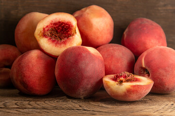 ripe sweet juicy peaches on wooden table close up shallow depth of field