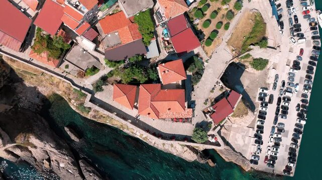 Birdview flying over the fortress of Ulcinj with its narrow streets near mala beach right at the adreatic ocean
