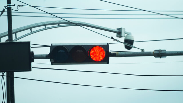 Red Traffic light installed at intersection in downtown Barru, Sulawesi Indonesia to prevent accident and vehicle crash.