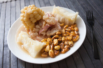 Peruvian traditional dish.fish ceviche with yuka and corn