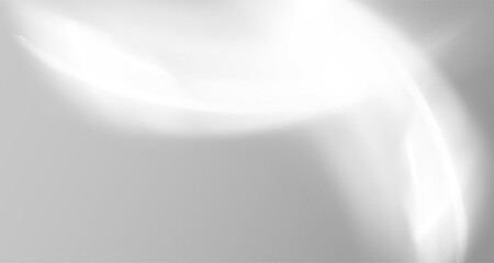 Glare from the sun's rays on the wall. Blurred shadows from leaves and plants in the room. 