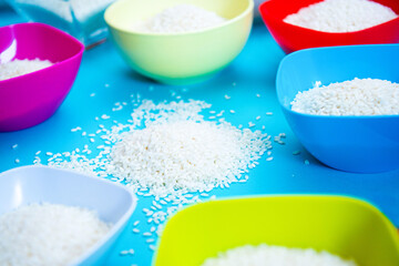 Italian Riso carnaroli or carnaroli rice typical of Piedmont area in Italy on blue background