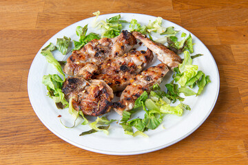 abbacchio a scottadito is the name of a typical dish of the cuisine of Rome and the Lazio region made with lamb meat cooked lightly on the grill with garlic, oil and rosemary