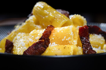 Pasta alla carbonara is the name of a type of pasta cooked with pork cheek, pecorino cheese and pepper, typical of the culinary tradition of Rome and the Lazio region in Italy.