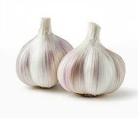 Obraz premium Two whole garlic bulbs with purple stripes, isolated on a white background.