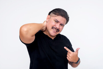 A middle aged man holding his nape, complaining about a stiff and sore neck. Isolated on a white...