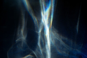 Natural light effects from sun flares on dark background. Rainbow refraction of sunlight