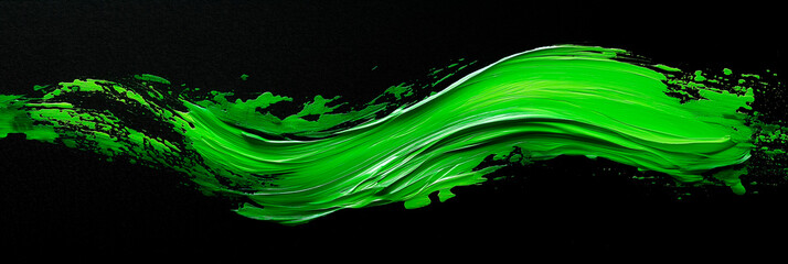 bright green brush stroke of paint on black background