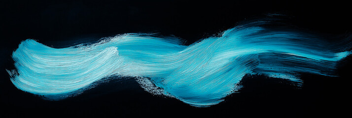 bright light blue brush stroke of paint on black background