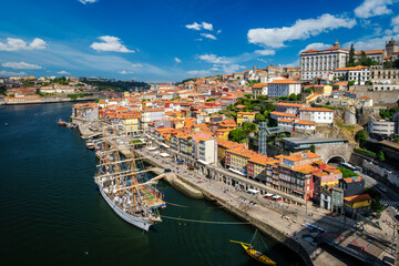 Aerial view of Porto city and Douro river with moored sailling ship from Dom Luis bridge I. Porto,...