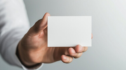 hand holding an empty white business card, set against a transparent background. This mockup is ideal for corporate business advertising and branding presentations, offering flexib