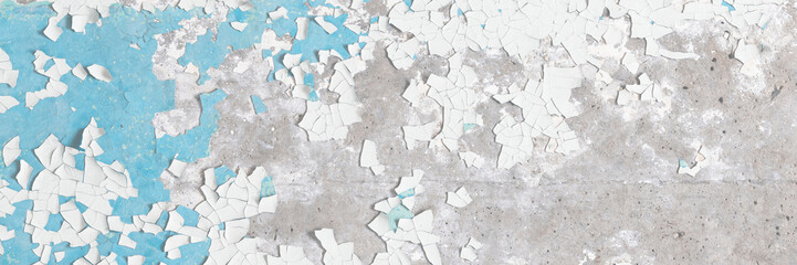 Peeling paint on the wall. Old concrete wall with cracked flaking paint. Weathered rough painted...