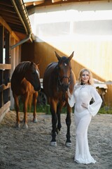 Obraz premium Portrait of beautiful blonde curl woman in dress, accessories with horse
