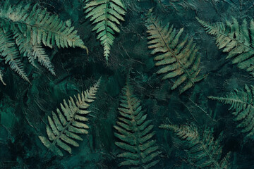 A dark green textured surface with faint, organic patterns that evoke the appearance of fern leaves, adding an earthy, natural touch.