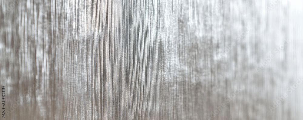 Poster a silver textured surface with a soft, brushed finish, highlighted by fine, linear patterns that add