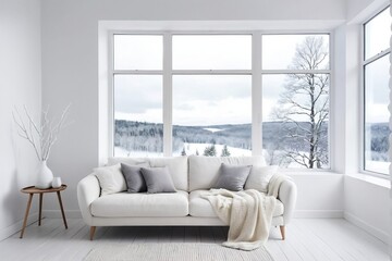 White living room with sofa and winter landscape from a large window. Winter Living Room Concept.