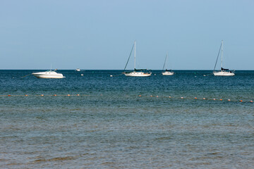 Sailboats and motorboats moored just off the Ephfraim, Wisconsin shore in Door County in early September