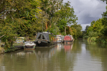 Moored narrowboats on a canal in England