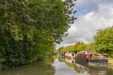 Moored narrowboats on a canal in England