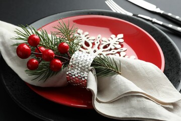 Christmas setting with festive decor on dark table, closeup