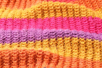 Obraz premium Texture of colorful knitted fabric as background, closeup