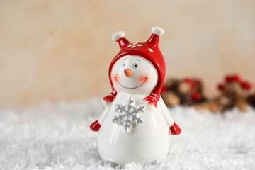 Funny decorative snowman figure on artificial snow