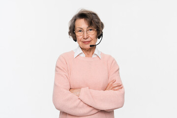 Call center. Caucasian mature senior elderly woman hotline worker IT support manager in headset...