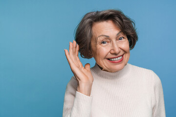 Elderly curious nosy woman mature lady try to hear you overhear listening intently doing...